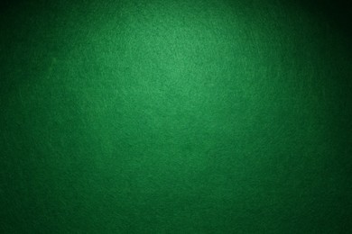 Green poker table as background, top view