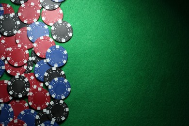 Photo of Poker chips on green table, flat lay. Space for text