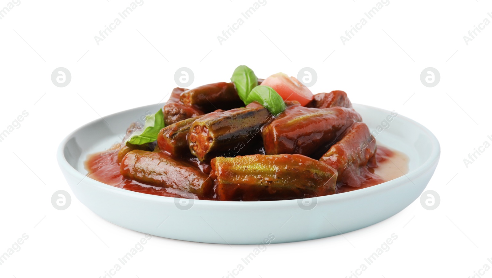 Photo of Tasty stew with okra, tomato sauce and basil isolated on white