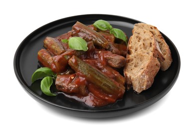 Photo of Tasty stew with okra, tomato sauce, bread and basil isolated on white