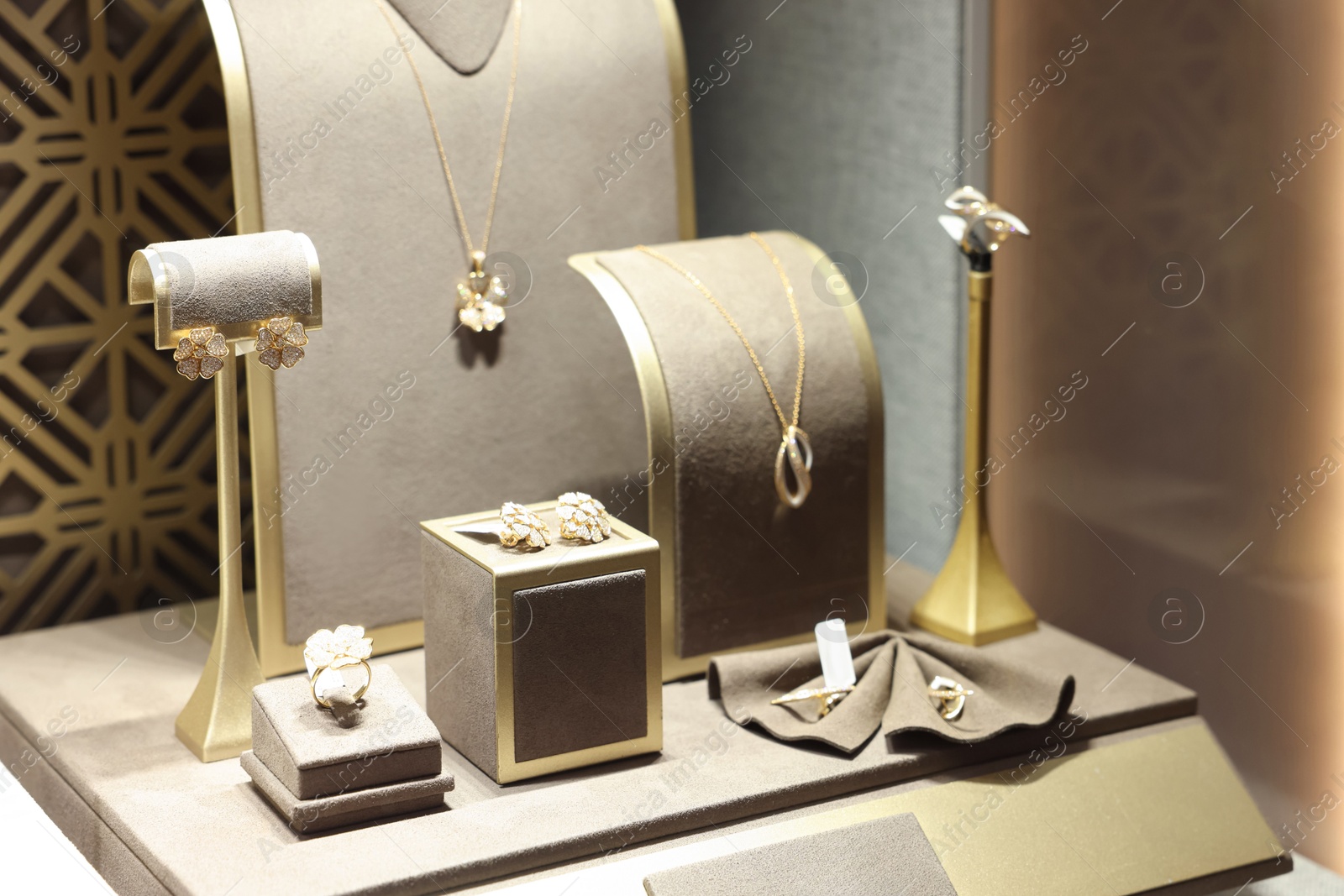 Photo of Store display with different jewelry in shopping mall, selective focus