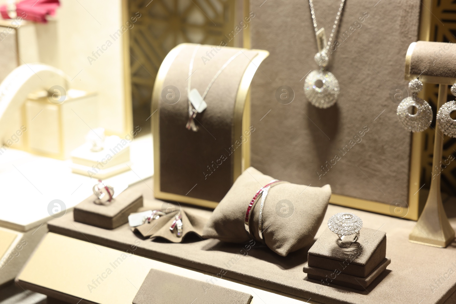 Photo of Store display with different jewelry in shopping mall, selective focus