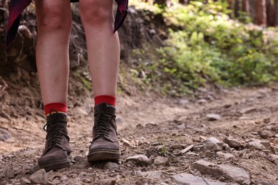 Photo of Young hiker in forest, closeup. Space for text