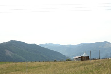 Beautiful view of forest and building in mountains under sky