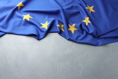 Photo of Flag of European Union on light grey table, above view