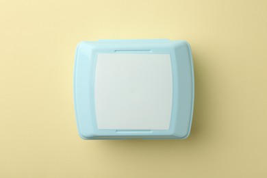 Photo of One lunch box on beige background, top view