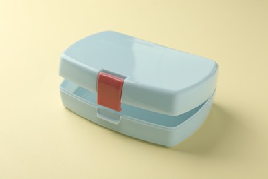 Photo of One empty lunch box on beige background