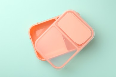 Photo of One empty lunch box on light blue background, top view