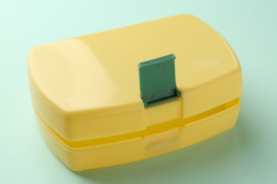 Photo of One empty lunch box on light blue background