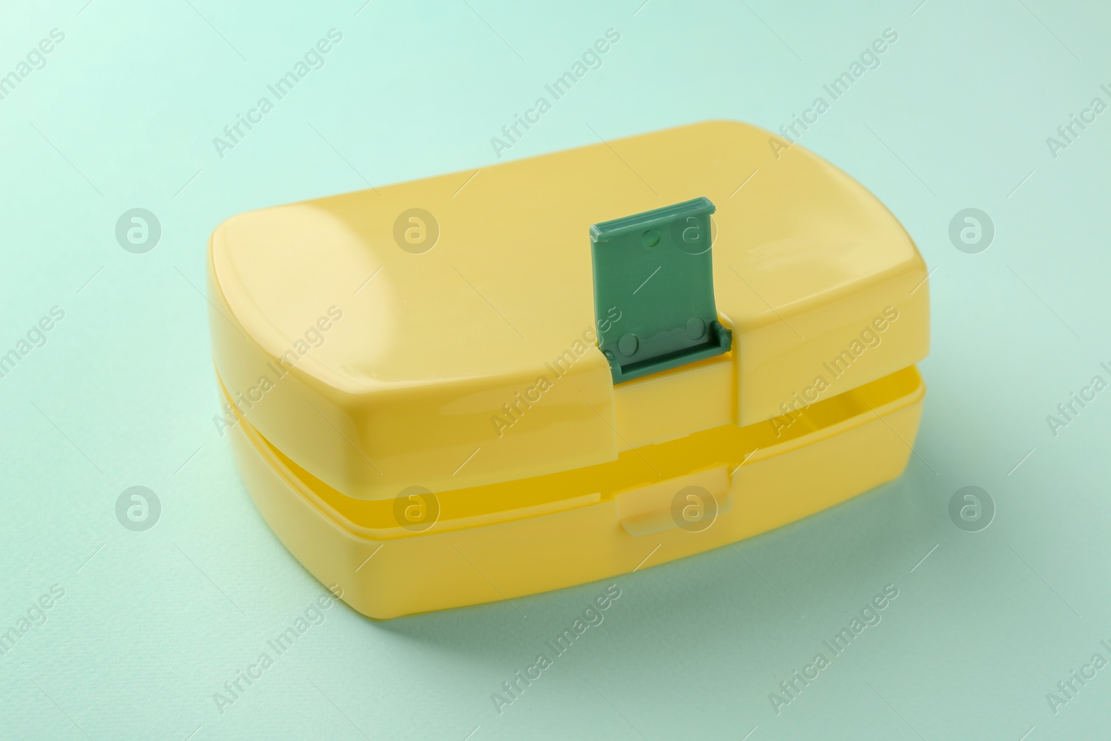 Photo of One empty lunch box on light blue background