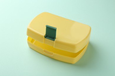 Photo of One empty lunch box on light blue background