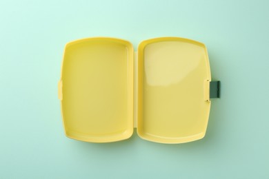 Photo of One empty lunch box on light blue background, top view