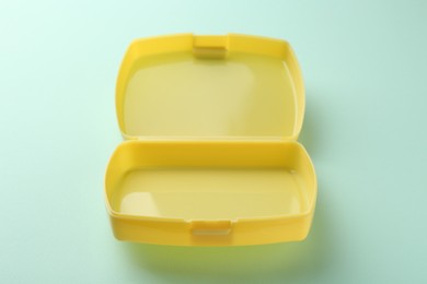 Photo of One empty lunch box on light blue background