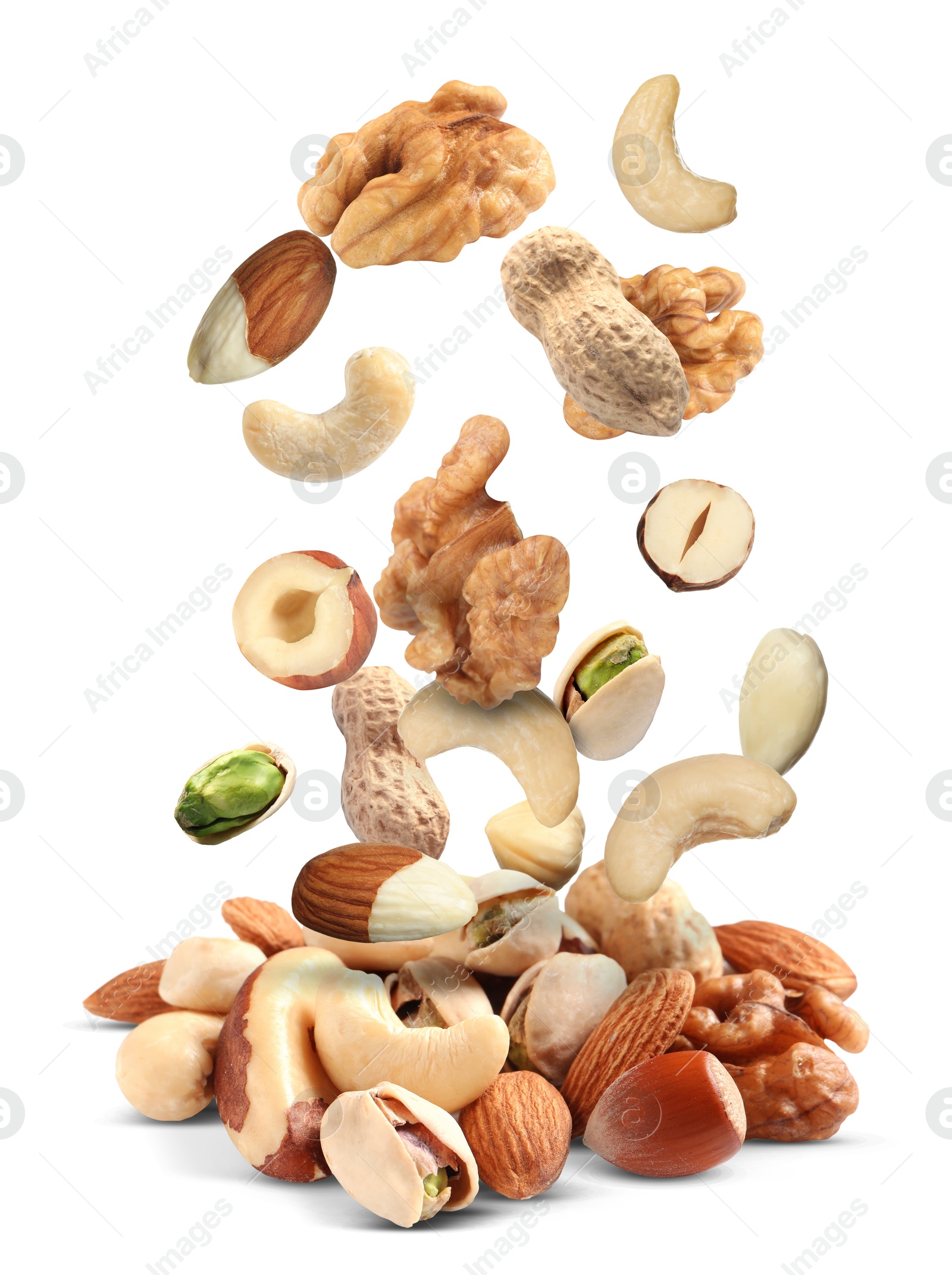 Image of Mix of nuts falling on white background