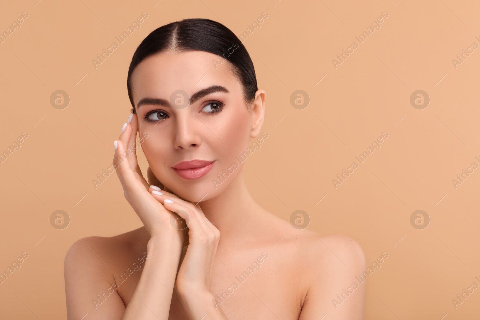 Image of Beautiful woman with perfect skin on beige background