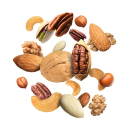 Image of Pecan and other nuts in air on white background