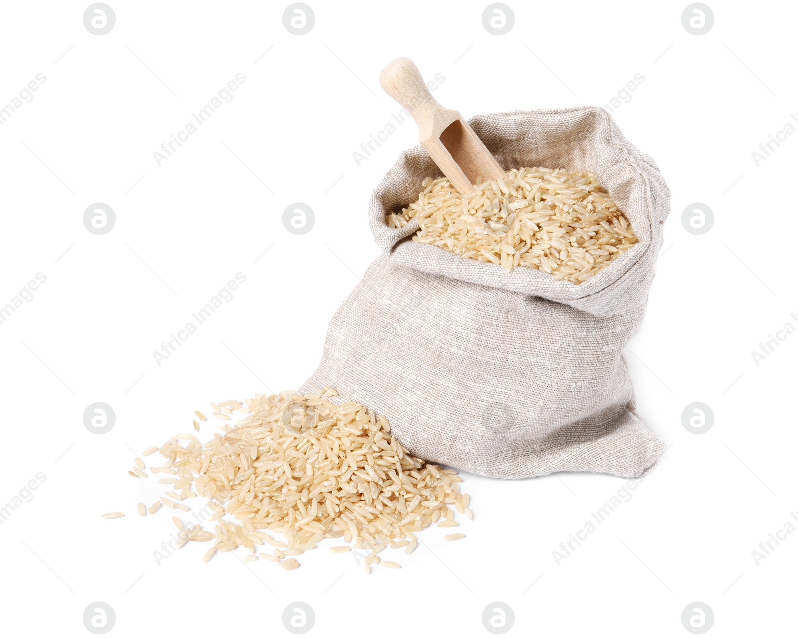 Photo of Raw rice in burlap with scoop isolated on white