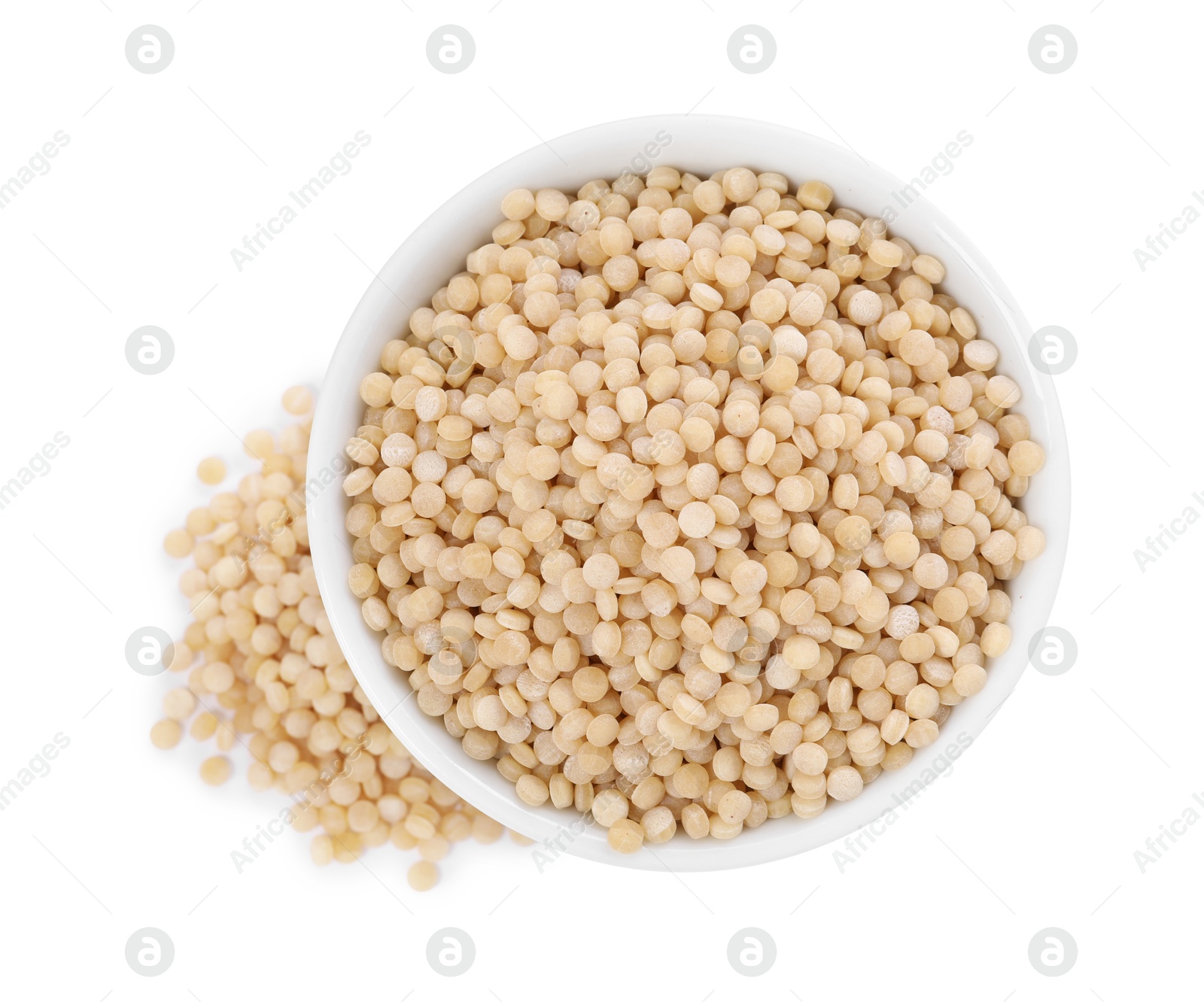 Photo of Raw couscous in bowl isolated on white, top view