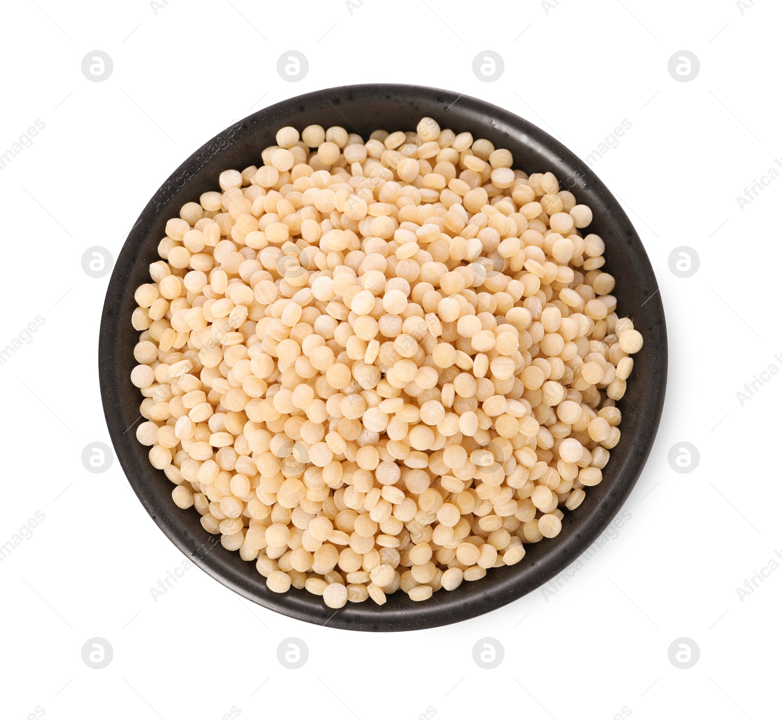 Photo of Raw couscous in bowl isolated on white, top view