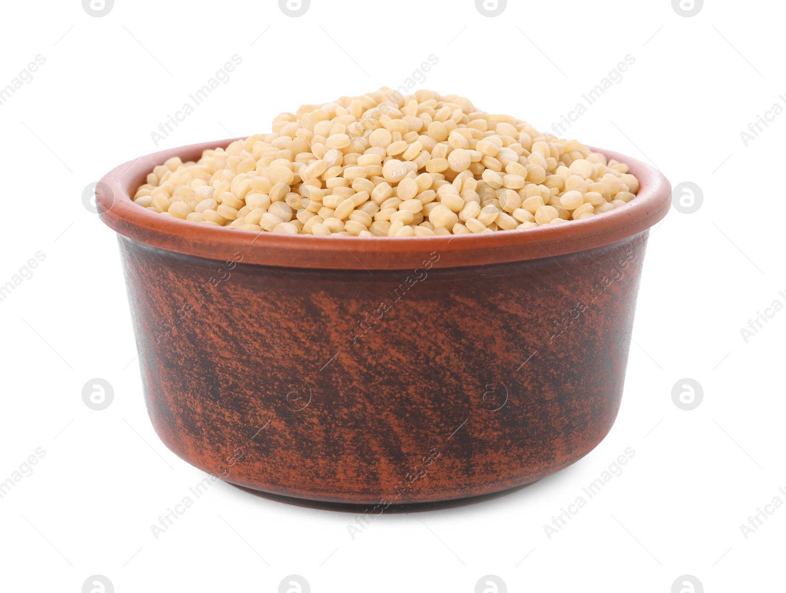 Photo of Raw couscous in bowl isolated on white