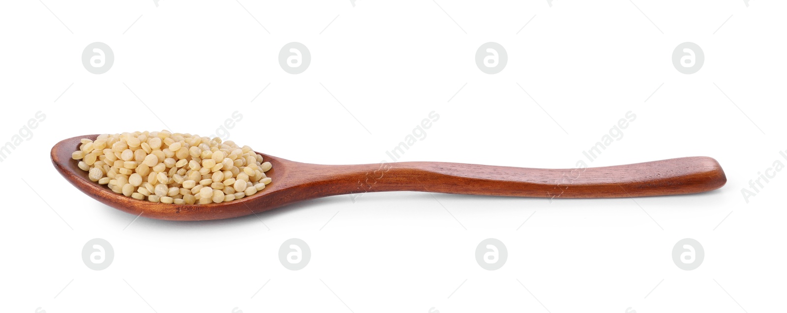 Photo of Raw couscous in wooden spoon isolated on white