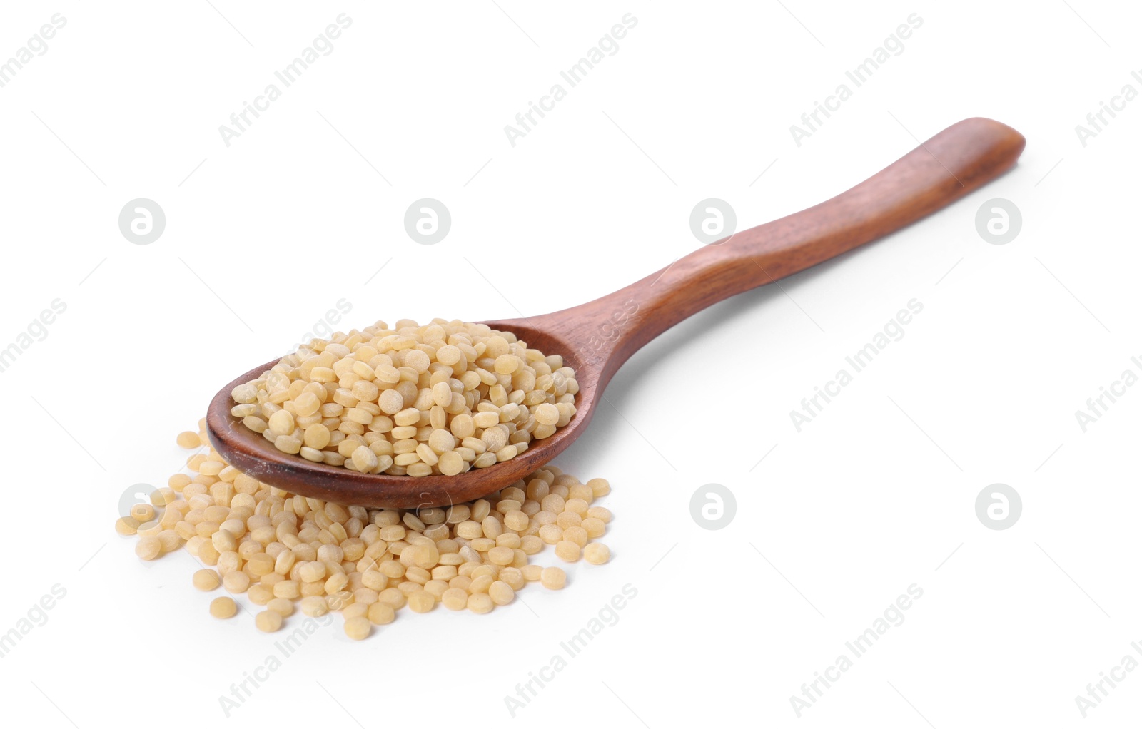 Photo of Raw couscous in wooden spoon isolated on white