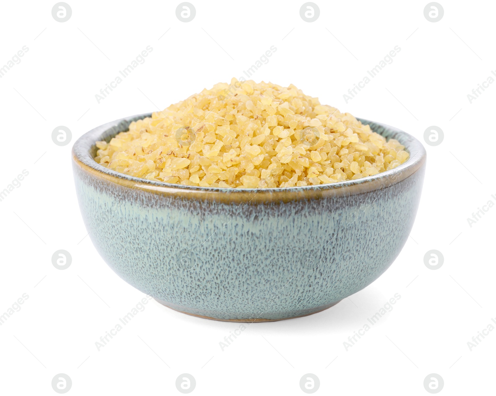 Photo of Raw bulgur in bowl isolated on white