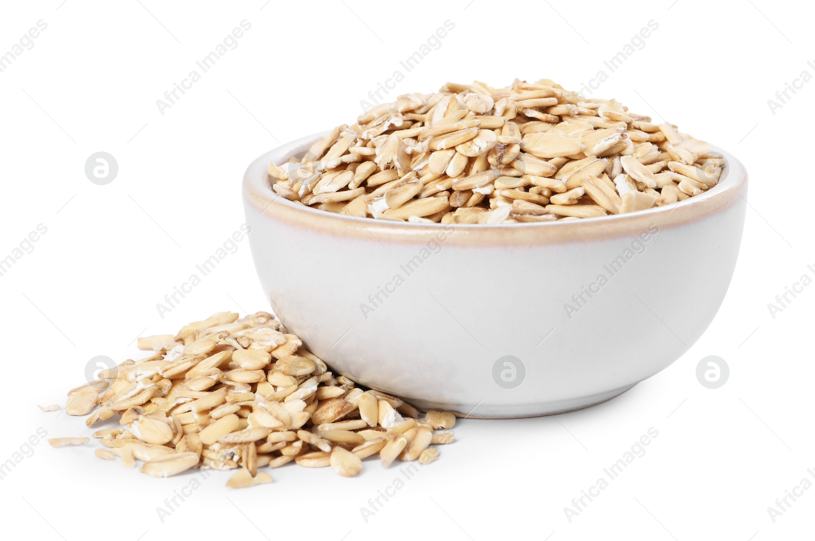 Photo of Dry oat flakes in bowl isolated on white