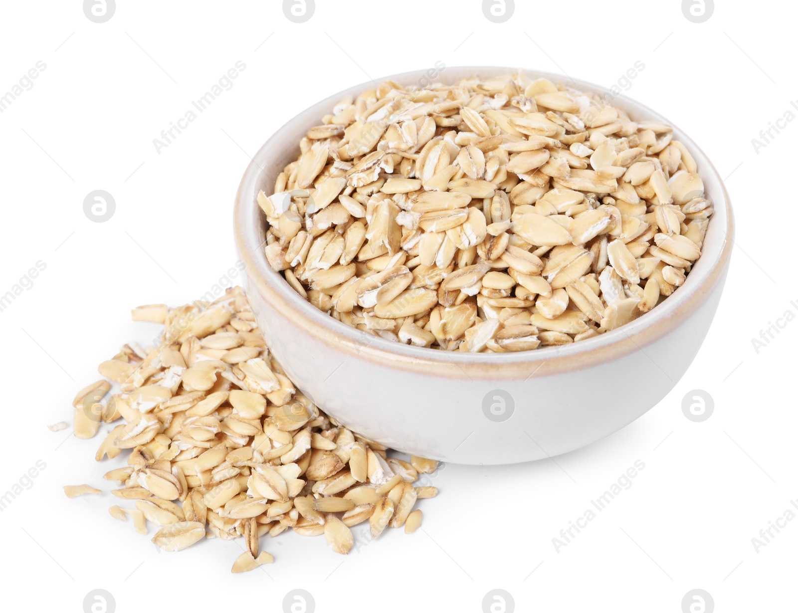 Photo of Dry oat flakes in bowl isolated on white