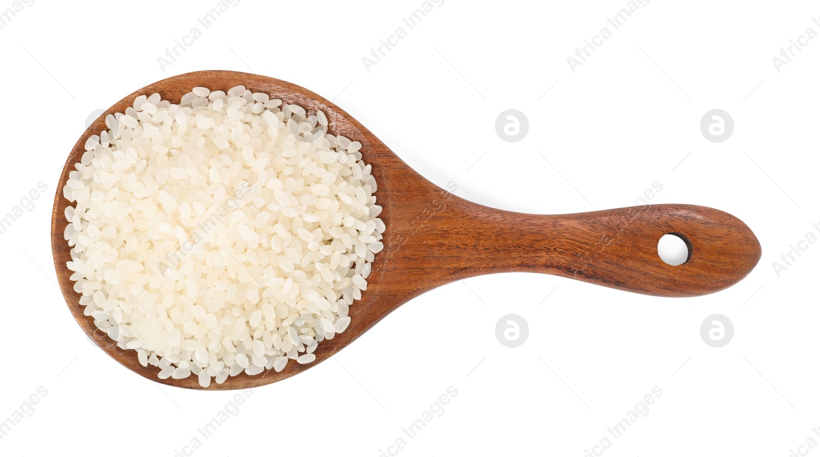 Photo of Raw rice in wooden spoon isolated on white, top view