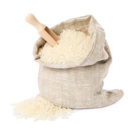 Photo of Raw rice in burlap sack and wooden scoop isolated on white