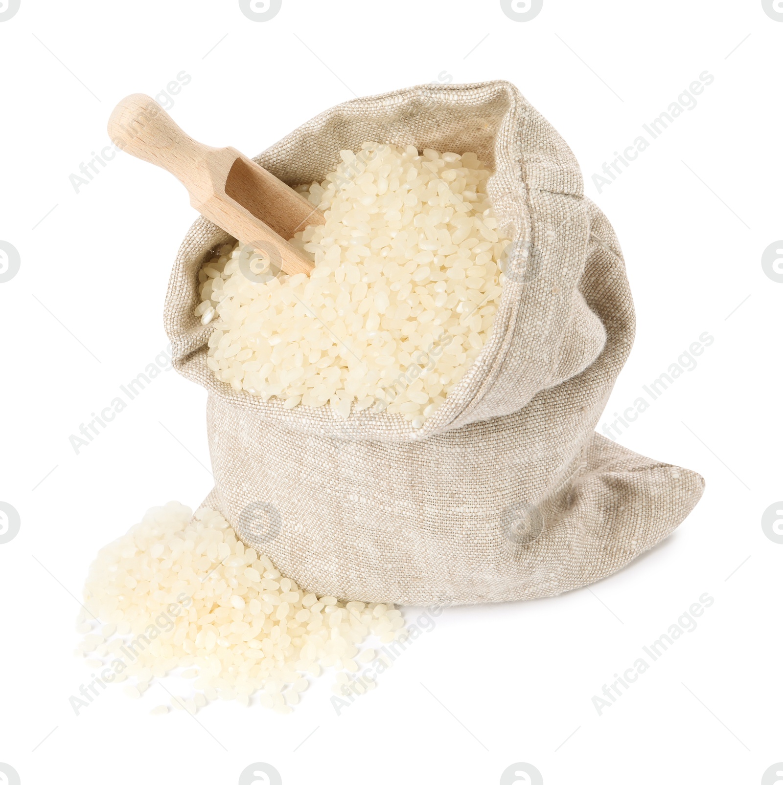 Photo of Raw rice in burlap sack and wooden scoop isolated on white