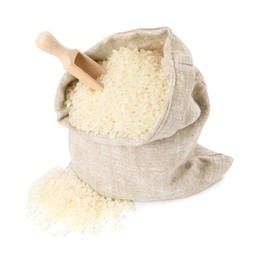 Photo of Raw rice in burlap sack and wooden scoop isolated on white