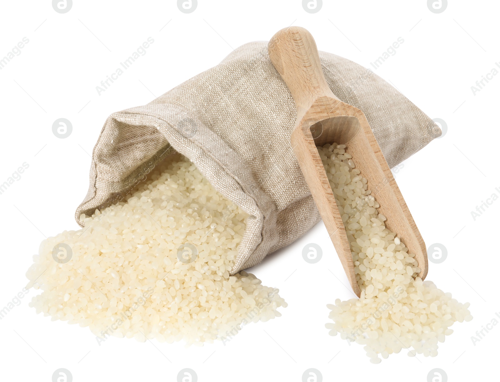 Photo of Raw rice, overturned burlap sack and wooden scoop isolated on white