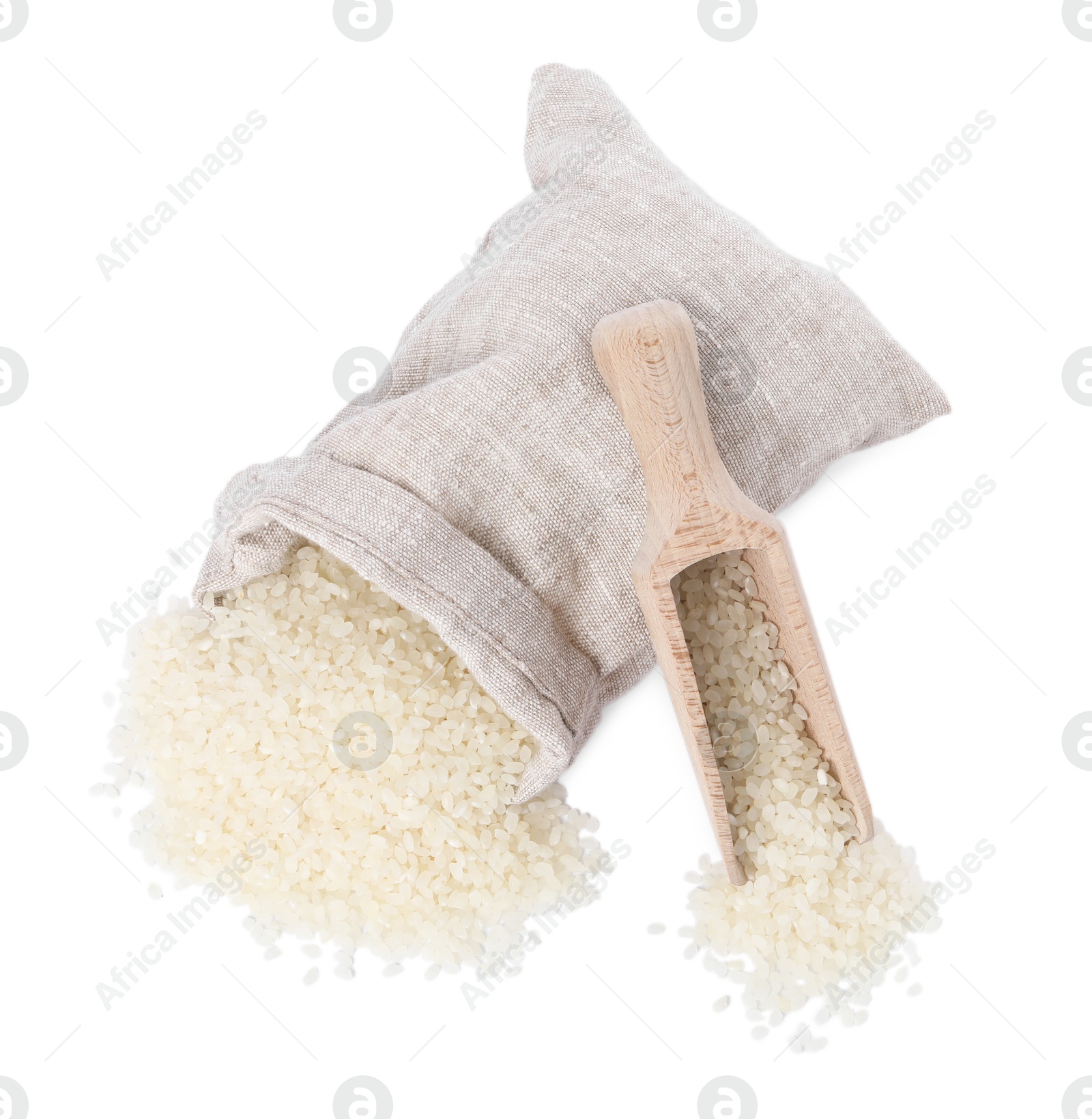 Photo of Raw rice, overturned burlap sack and wooden scoop isolated on white, top view