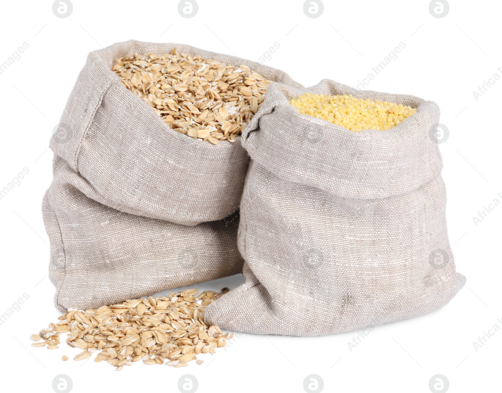 Photo of Different cereal grains in burlap sacks isolated on white