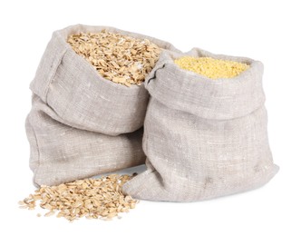 Photo of Different cereal grains in burlap sacks isolated on white