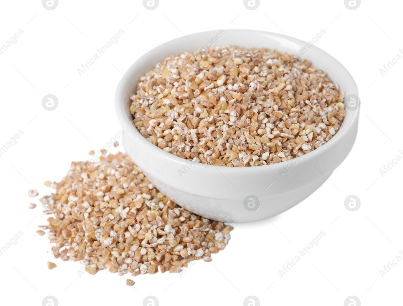 Photo of Dry wheat groats in bowl isolated on white