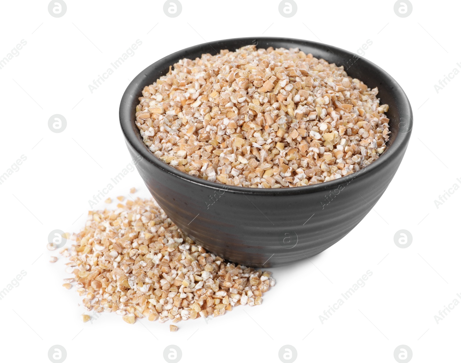 Photo of Dry wheat groats in bowl isolated on white