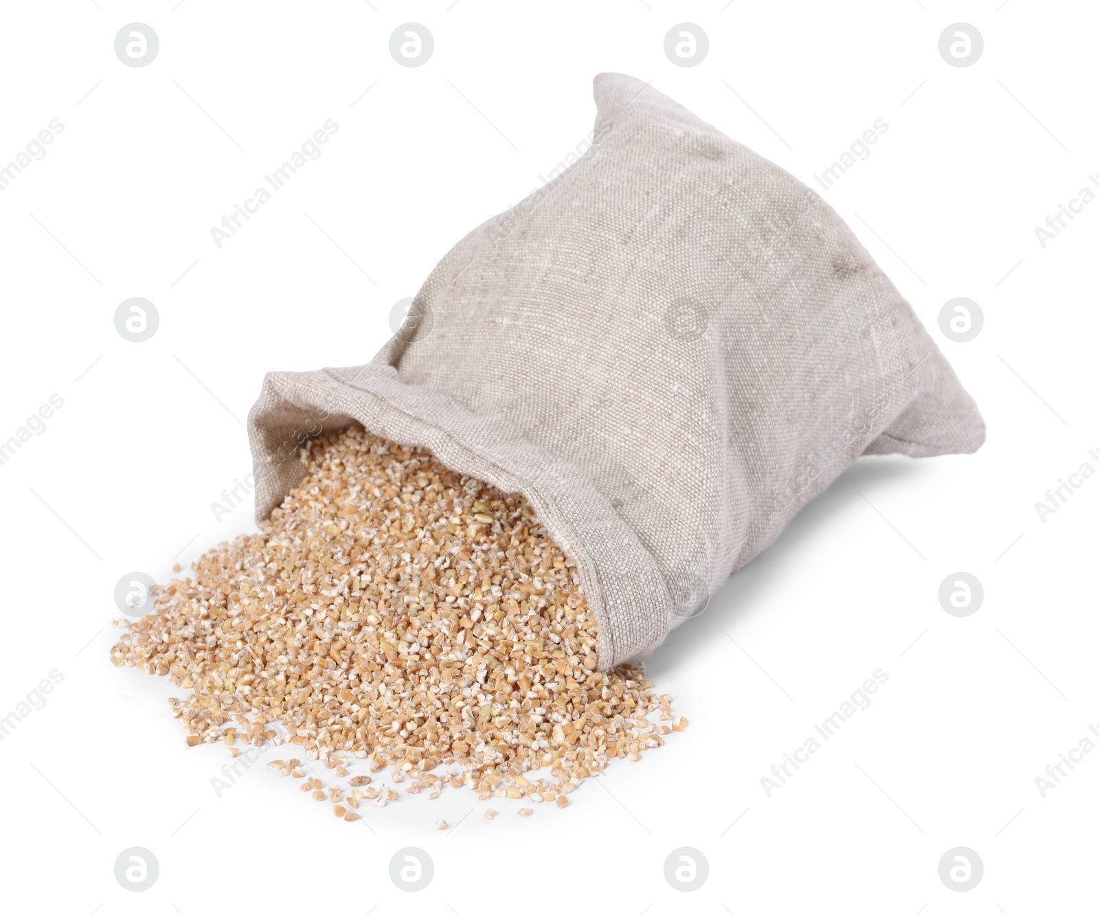 Photo of Dry wheat groats and overturned burlap sack isolated on white