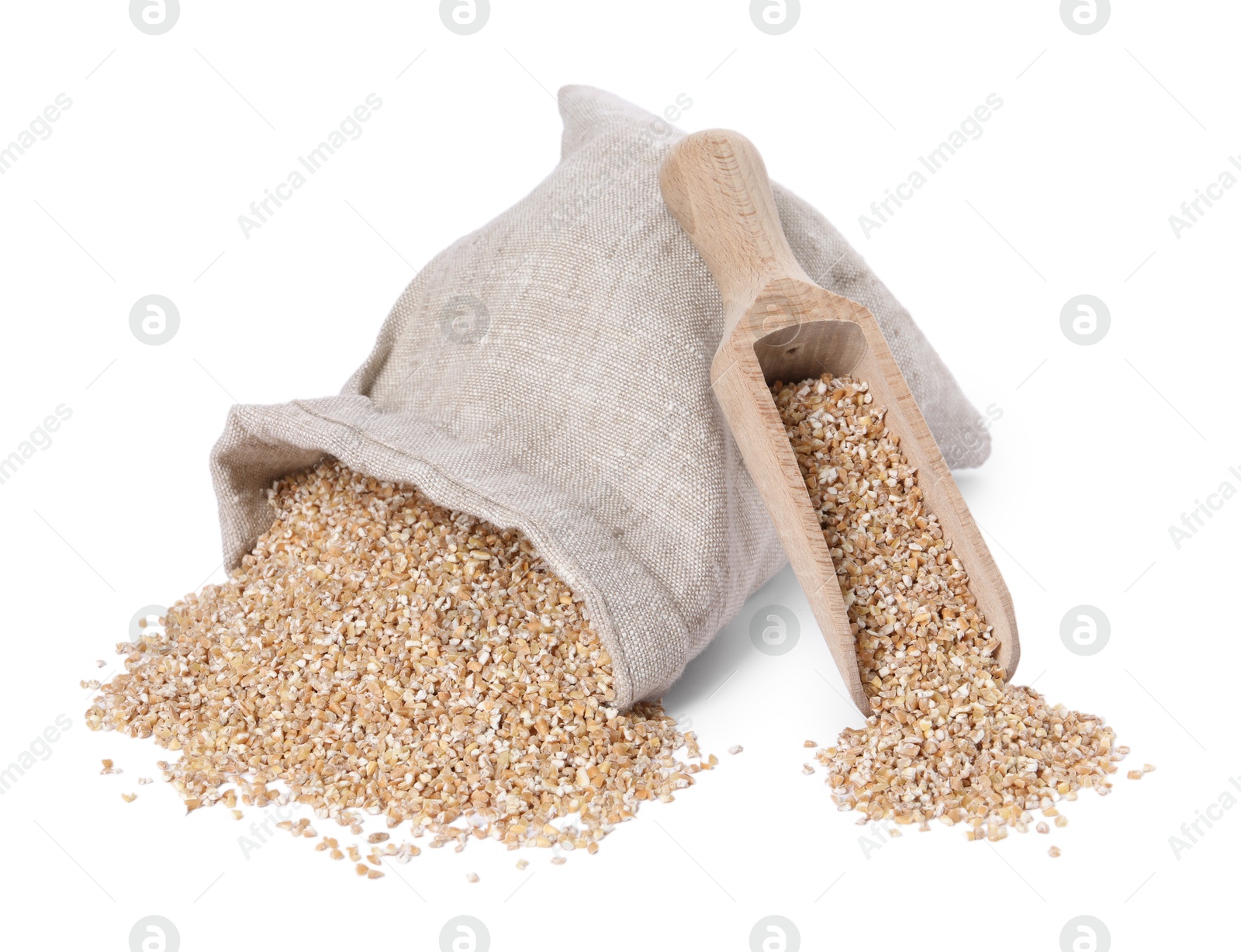 Photo of Dry wheat groats, overturned burlap sack and wooden scoop isolated on white