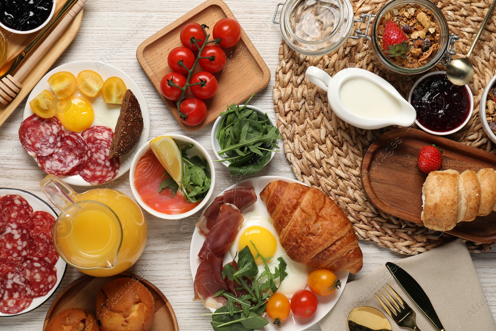 Photo of Different tasty food served for brunch on white wooden table, flat lay