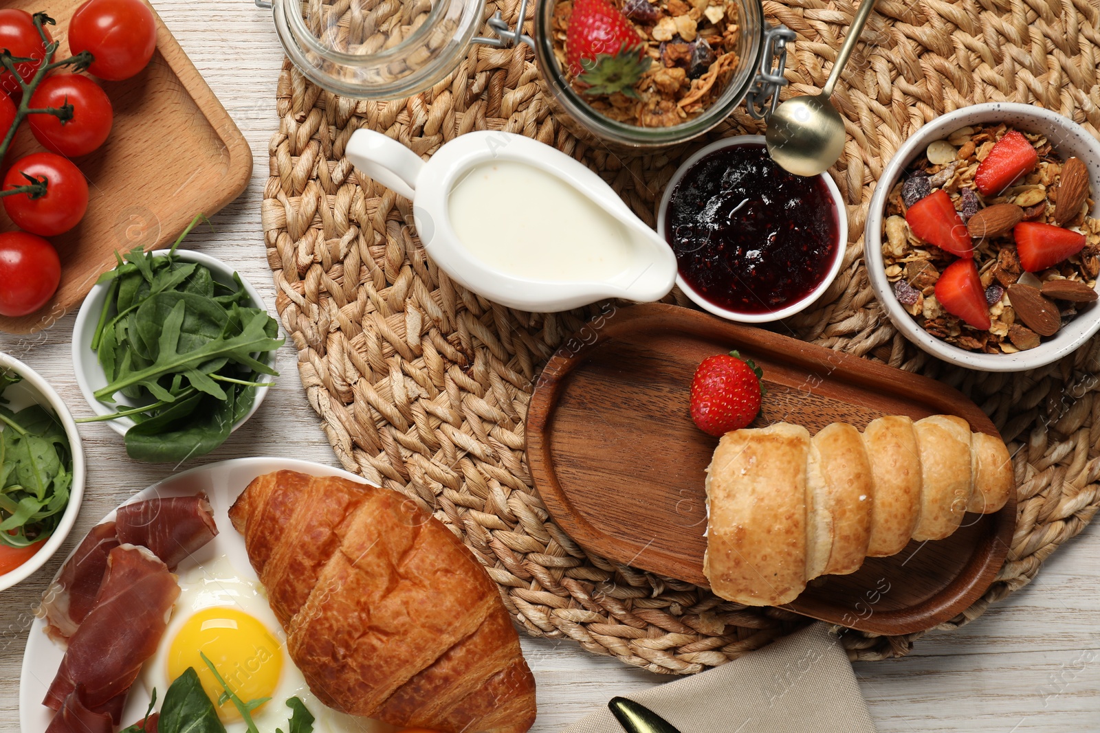 Photo of Different tasty food served for brunch on white wooden table, flat lay