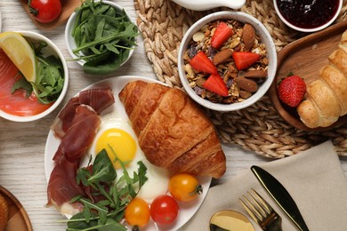 Photo of Different tasty food served for brunch on white wooden table, flat lay