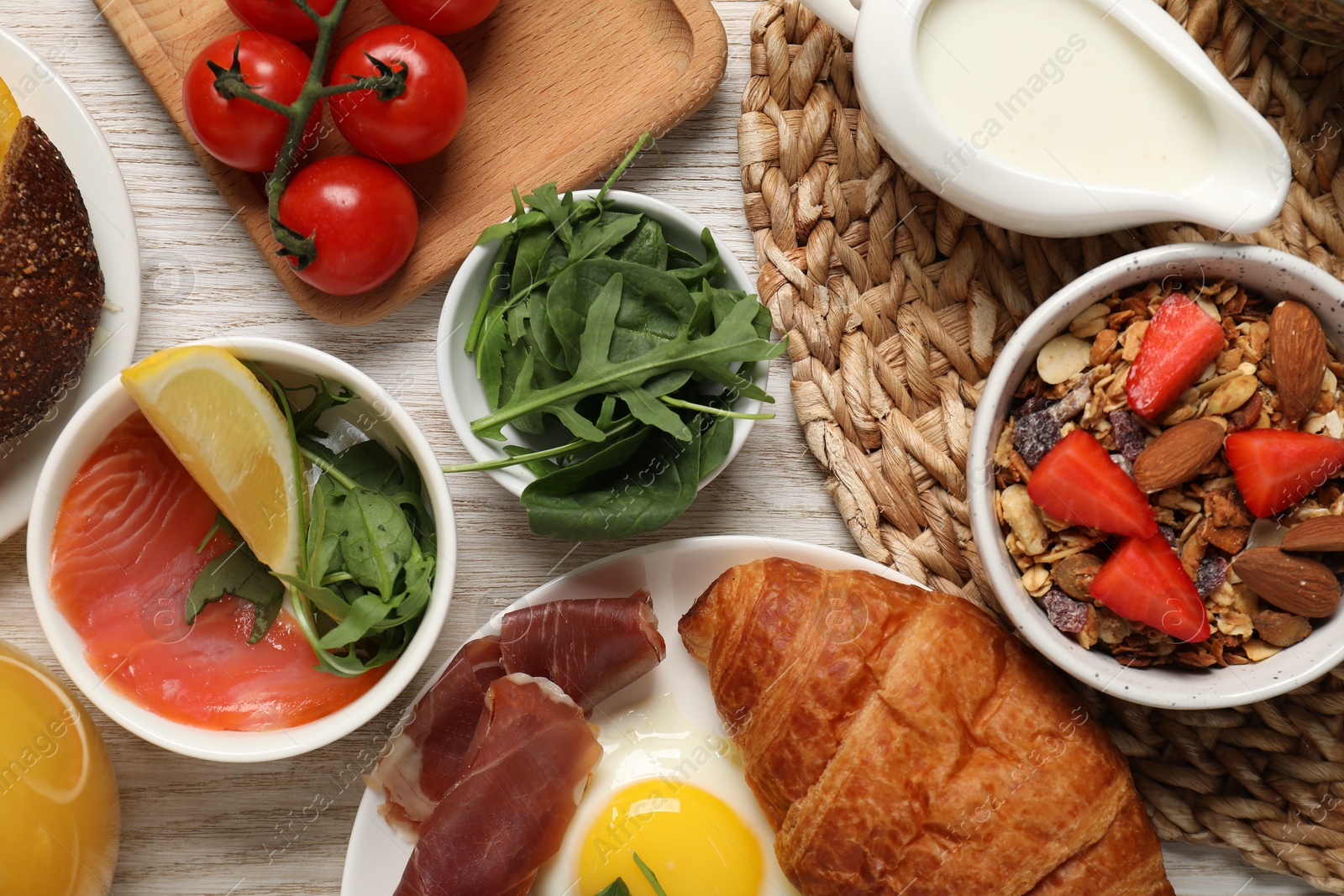 Photo of Different tasty food served for brunch on white wooden table, flat lay