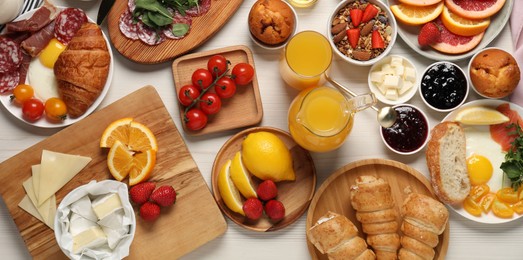 Photo of Different tasty food served for brunch on white wooden table, flat lay