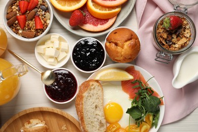 Photo of Different tasty food served for brunch on white wooden table, flat lay