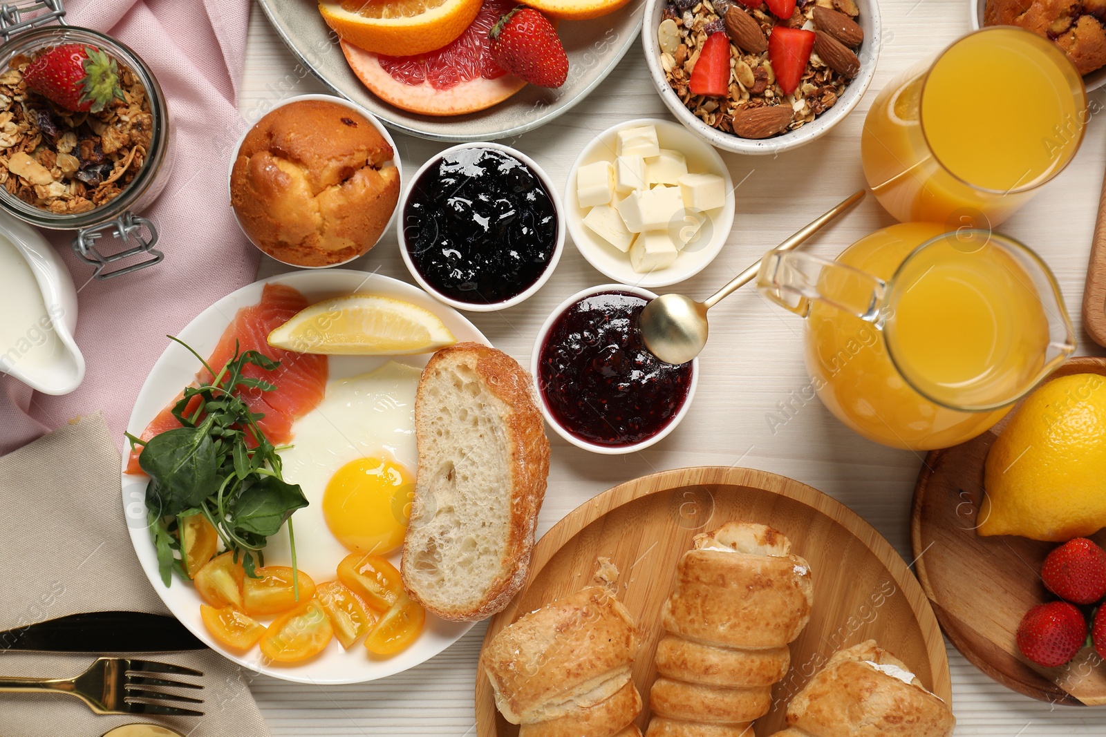 Photo of Different tasty food served for brunch on white wooden table, flat lay