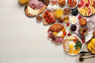 Photo of Different tasty food served for brunch on white wooden table, flat lay. Space for text