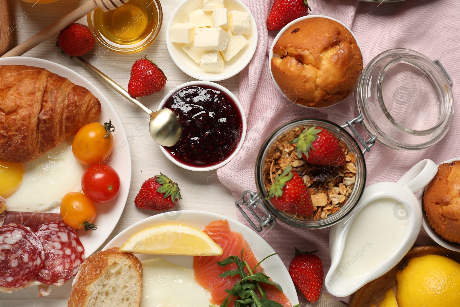 Photo of Different tasty food served for brunch on white wooden table, flat lay